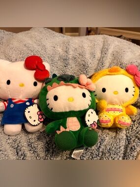Hello Kitty Plush Trio with Green Dino Outfit and Colorful Costumes